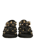 Sandales Dolce & Gabbana en cuir noir avec studs, chaussures élégantes à semelle plate et design tendance.