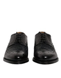 Chaussures Derby en cuir noir Dolce & Gabbana avec bouts en wingtip et lacets, chaussures formelles élégantes pour homme.