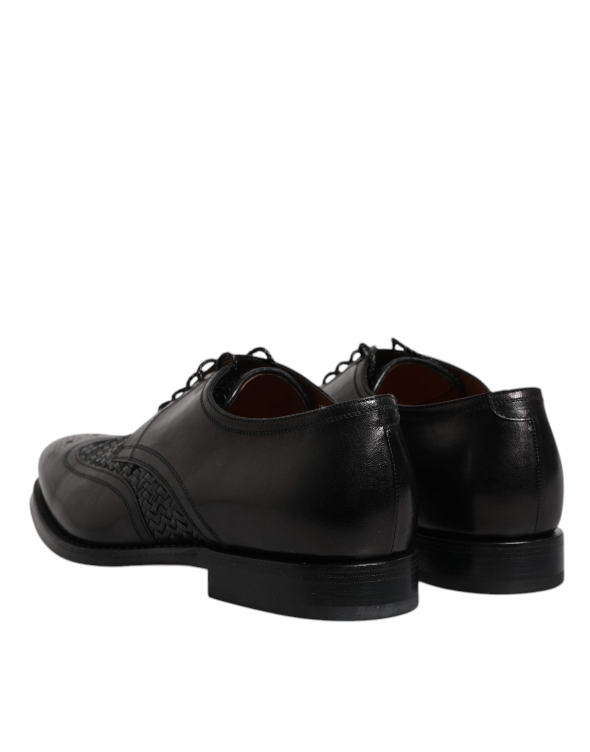 Chaussures habillées Derby Wingtip en cuir noir de Dolce & Gabbana, lacets, style formel et élégant.