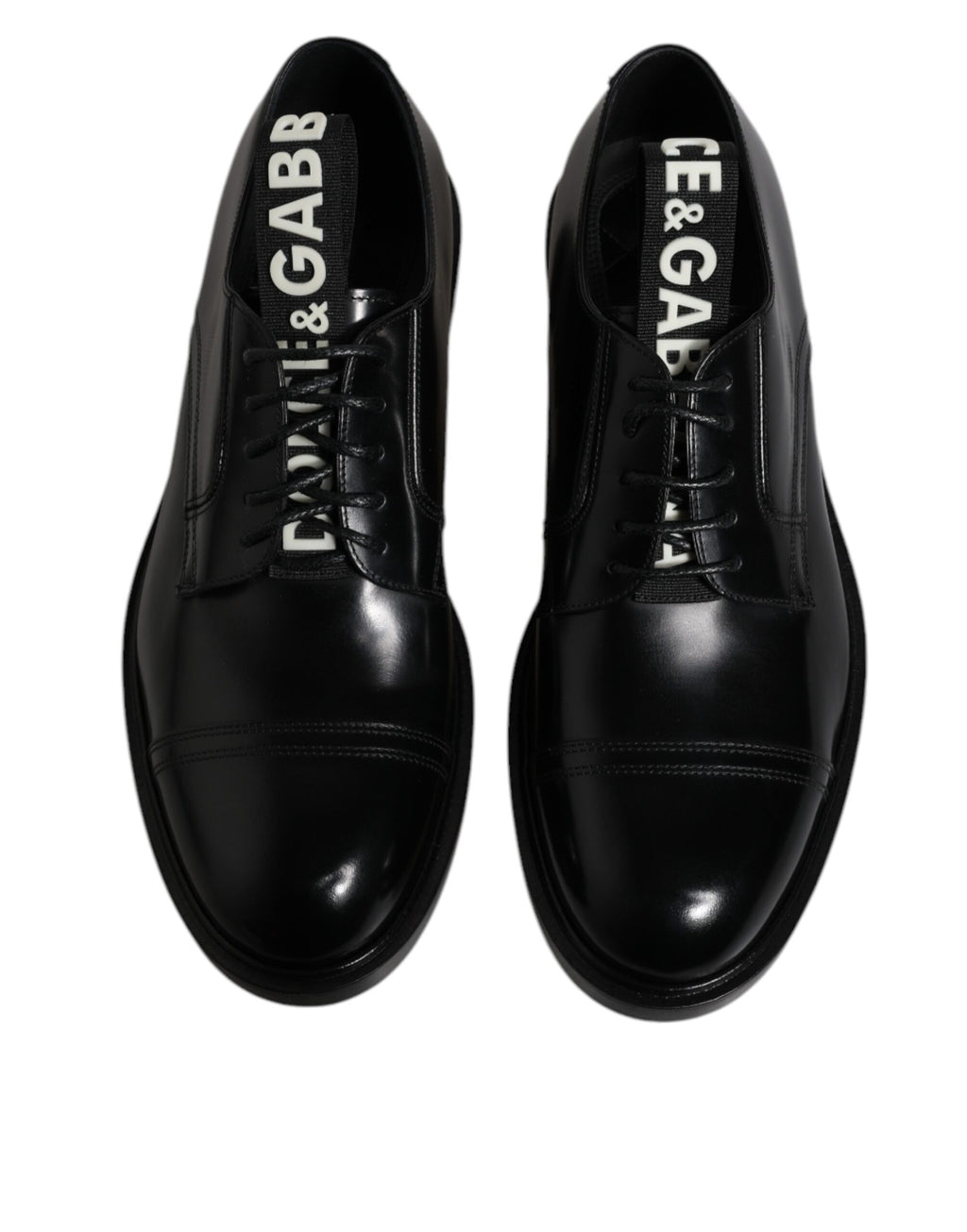 Chaussures derby noires en cuir brillant de Dolce & Gabbana, lace-up formelles élégantes et sophistiquées.