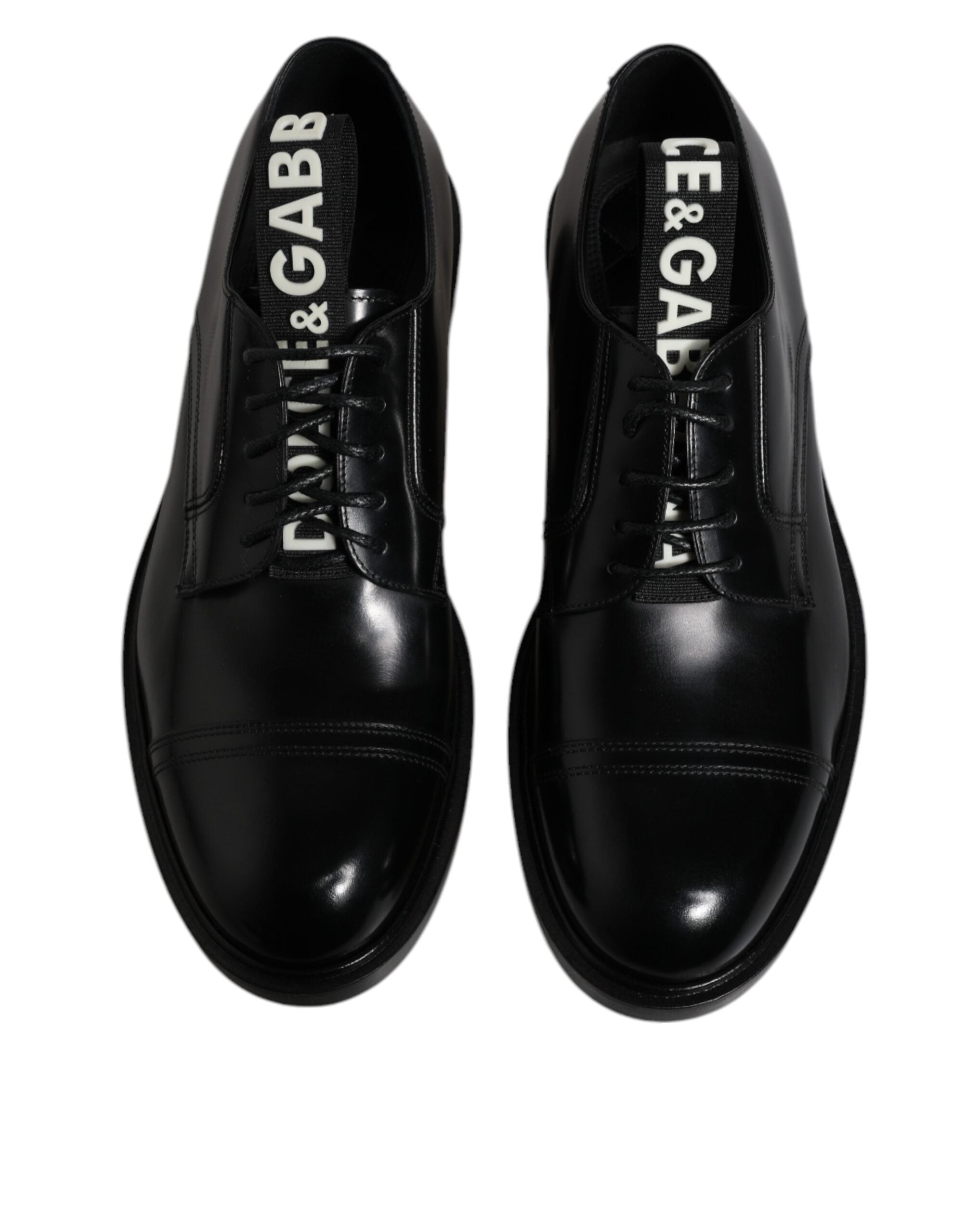 Chaussures derby noires en cuir brillant de Dolce & Gabbana, lace-up formelles élégantes et sophistiquées.