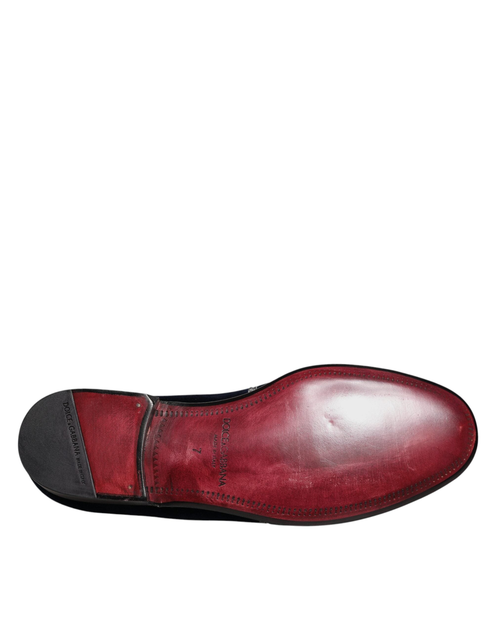 Chaussures habillées Dolce & Gabbana en velours noir avec motifs floraux et détail en forme de pistolet, chaussures de luxe élégantes.