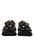 Sandales Dolce & Gabbana en cuir noir avec clous, chaussures à talon bas et style élégant.