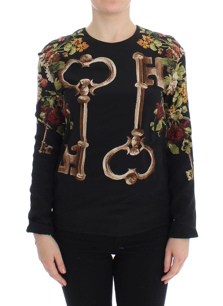Chemisier en soie noir Dolce & Gabbana avec motif floral clé, élégant haut à la mode pour femmes.