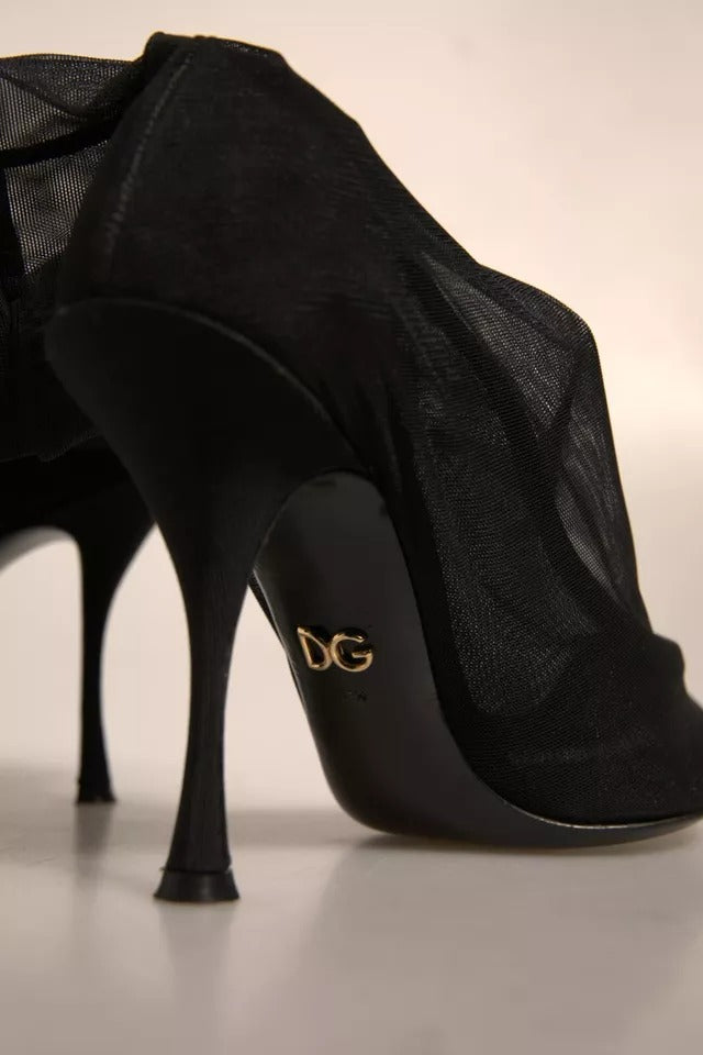 Escarpins noirs en dentelle de soie Dolce & Gabbana avec style chaussette, talons hauts et design élégant.