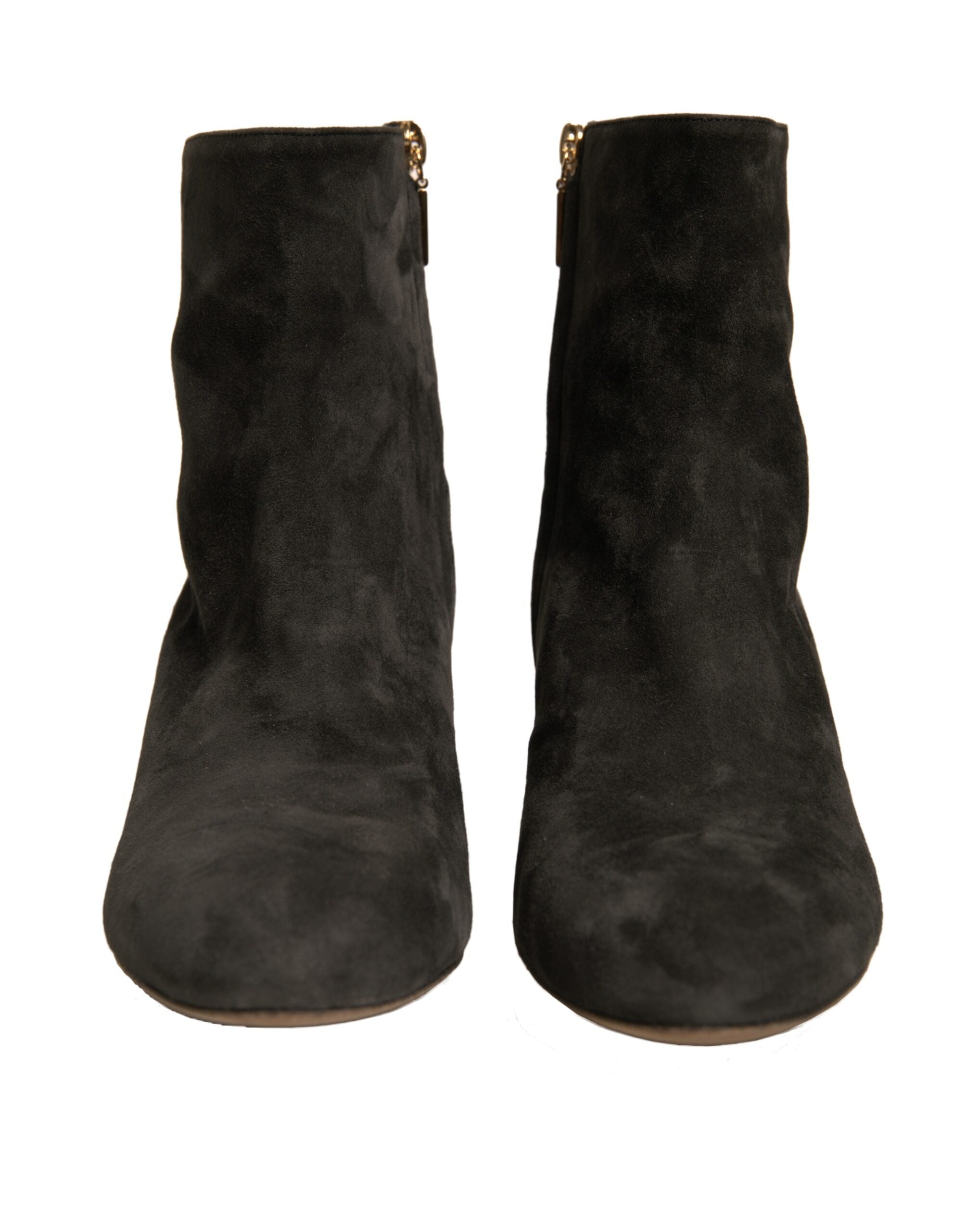 Bottines noires Dolce & Gabbana à talons avec embellissements et détails élégants visibles en gros plan.