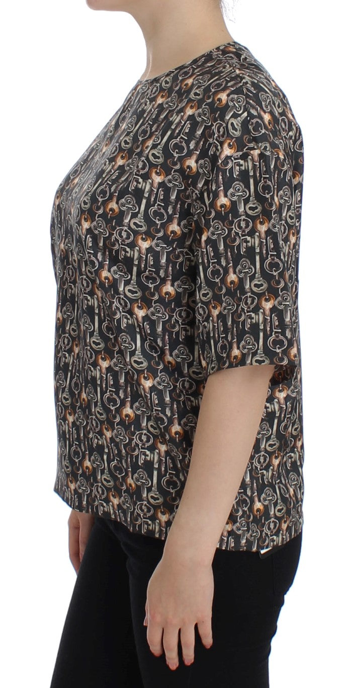 Chemise en soie Dolce & Gabbana gris or avec motif clé, élégante blouse tendance pour femme, détails raffinés et design sophistiqué.