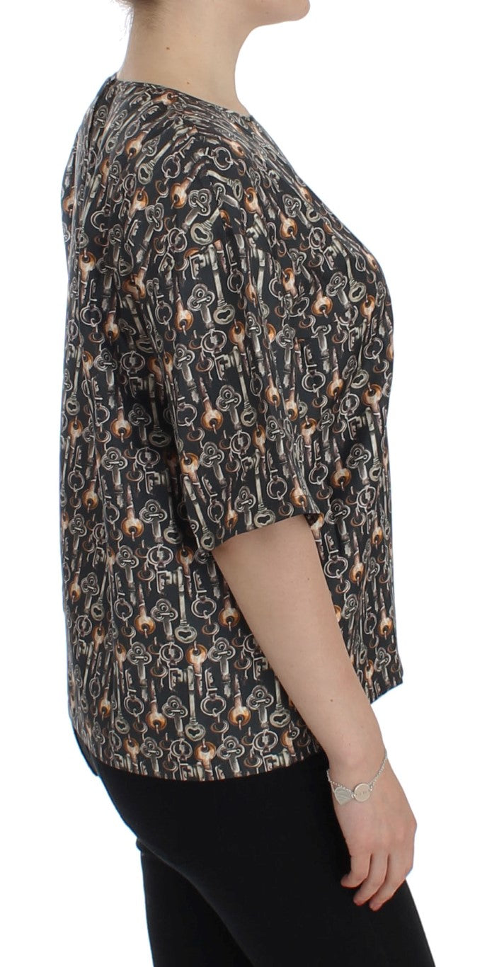 Chemise en soie Dolce & Gabbana gris or avec motif clé doré, blouse élégante et raffinée.