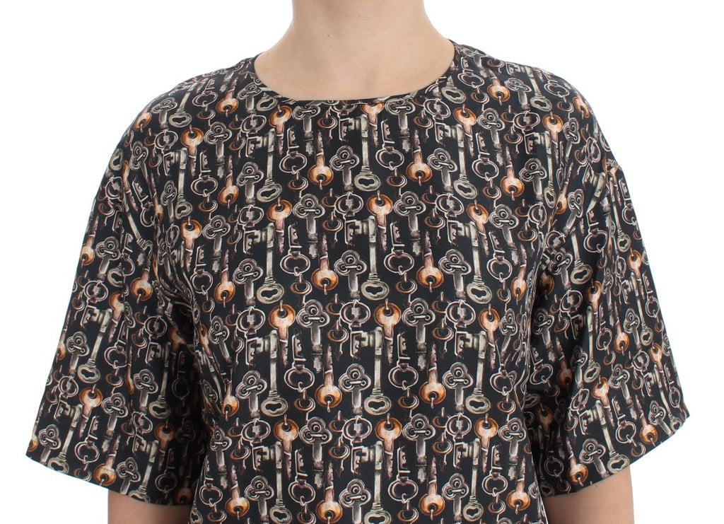 Chemise en soie Dolce & Gabbana à motif clé gris et or, élégante blouse T-shirt avec design sophistiqué et détails raffinés.