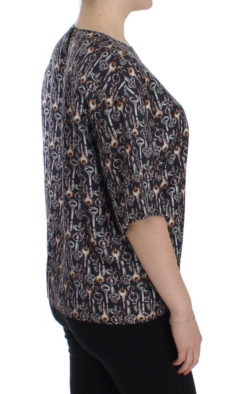 Chemise en soie Dolce & Gabbana gris or avec motif clé, coupe élégante et détails sophistiqués visible sur l'image.