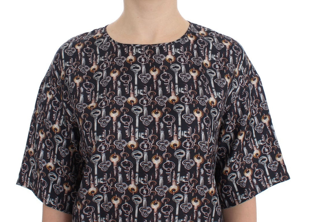 Chemise en soie Dolce & Gabbana gris or avec motif clé, style blouse ou t-shirt élégant et sophistiqué.