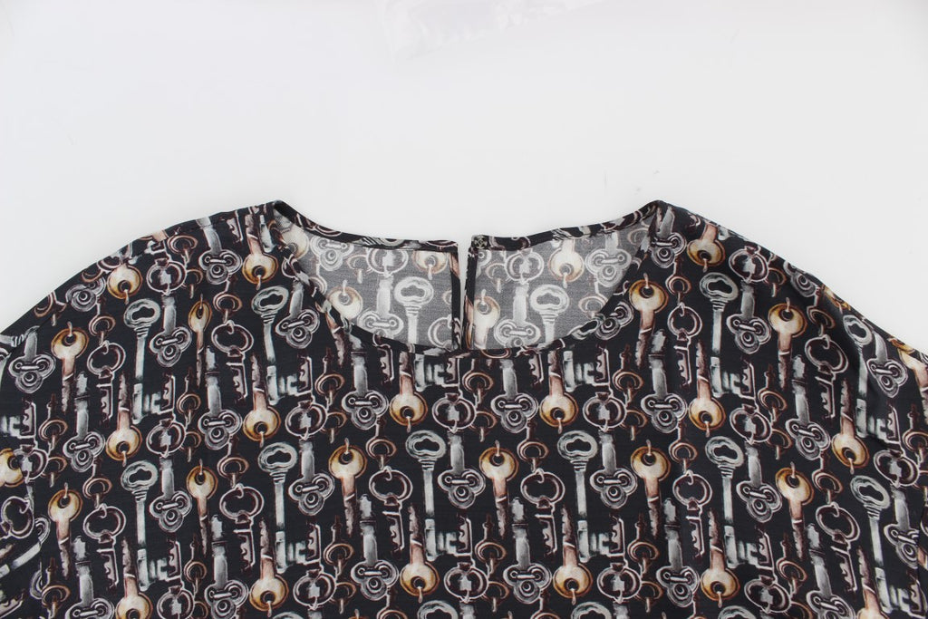 Chemise en soie gris et or avec motif clé Dolce & Gabbana, blouse élégante et sophistiquée.