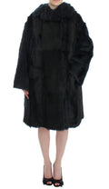 Veste longue en fourrure de chèvre noire de Dolce & Gabbana, avec col en shearling et design élégant.