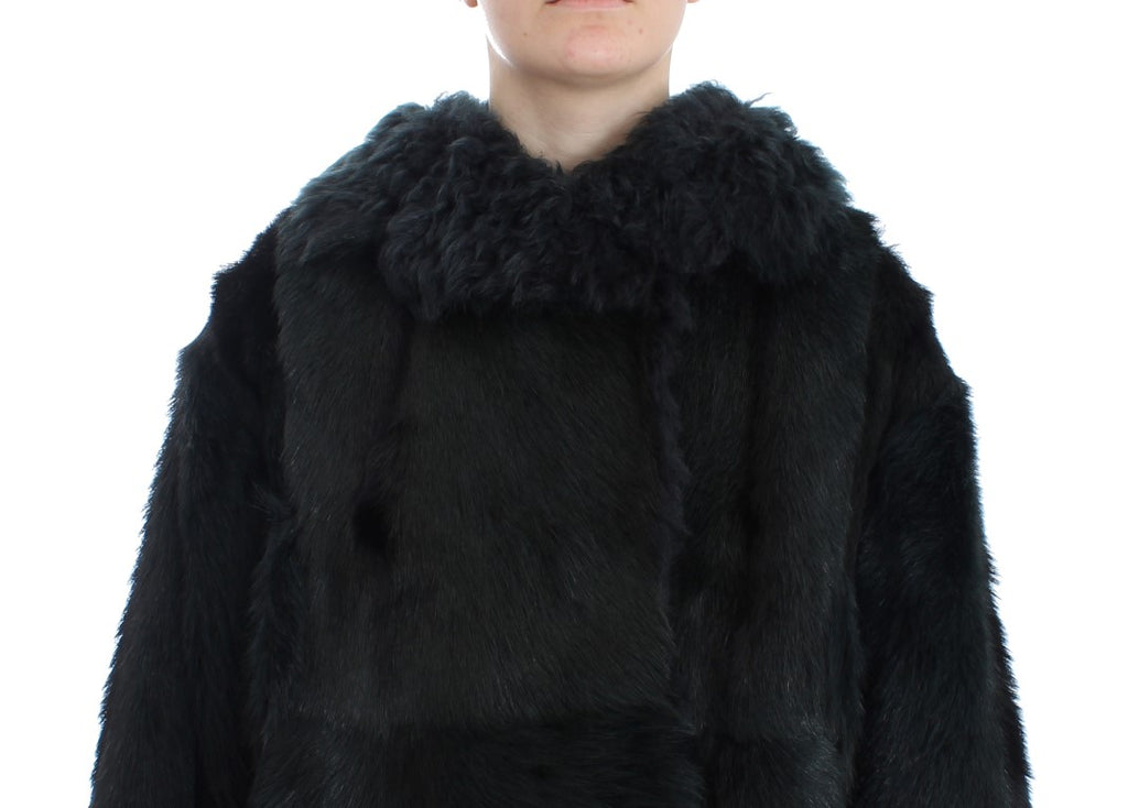 Manteau long en shearling de chèvre noir de Dolce & Gabbana, avec col en fourrure et coupe élégante.