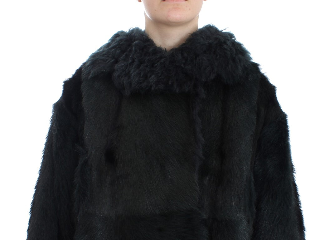 Manteau long en shearling de chèvre noir de Dolce & Gabbana, avec col en fourrure et coupe élégante.