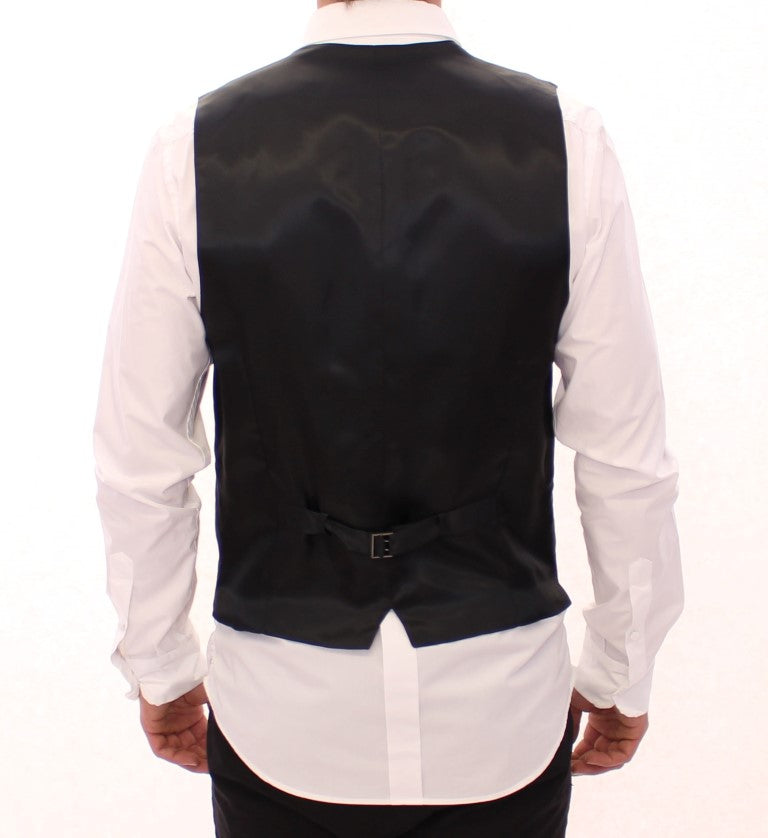 Gilet en laine gris à rayures de Dolce & Gabbana, à simple boutonnage, élégant et sophistiqué.