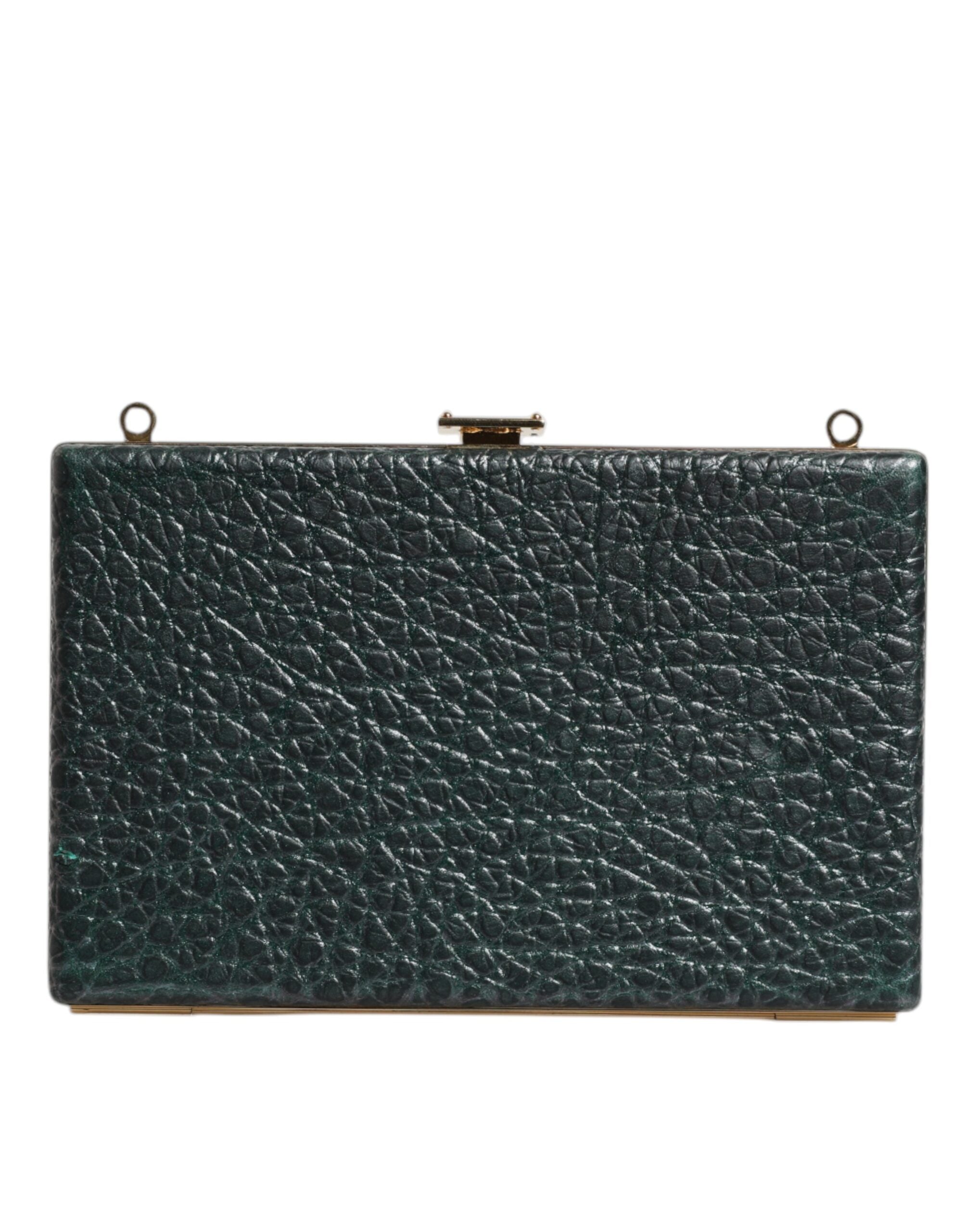 Sac clutch en cuir noir Dolce & Gabbana pour soirées, porté en croisé, avec détails élégants et finition sophistiquée.