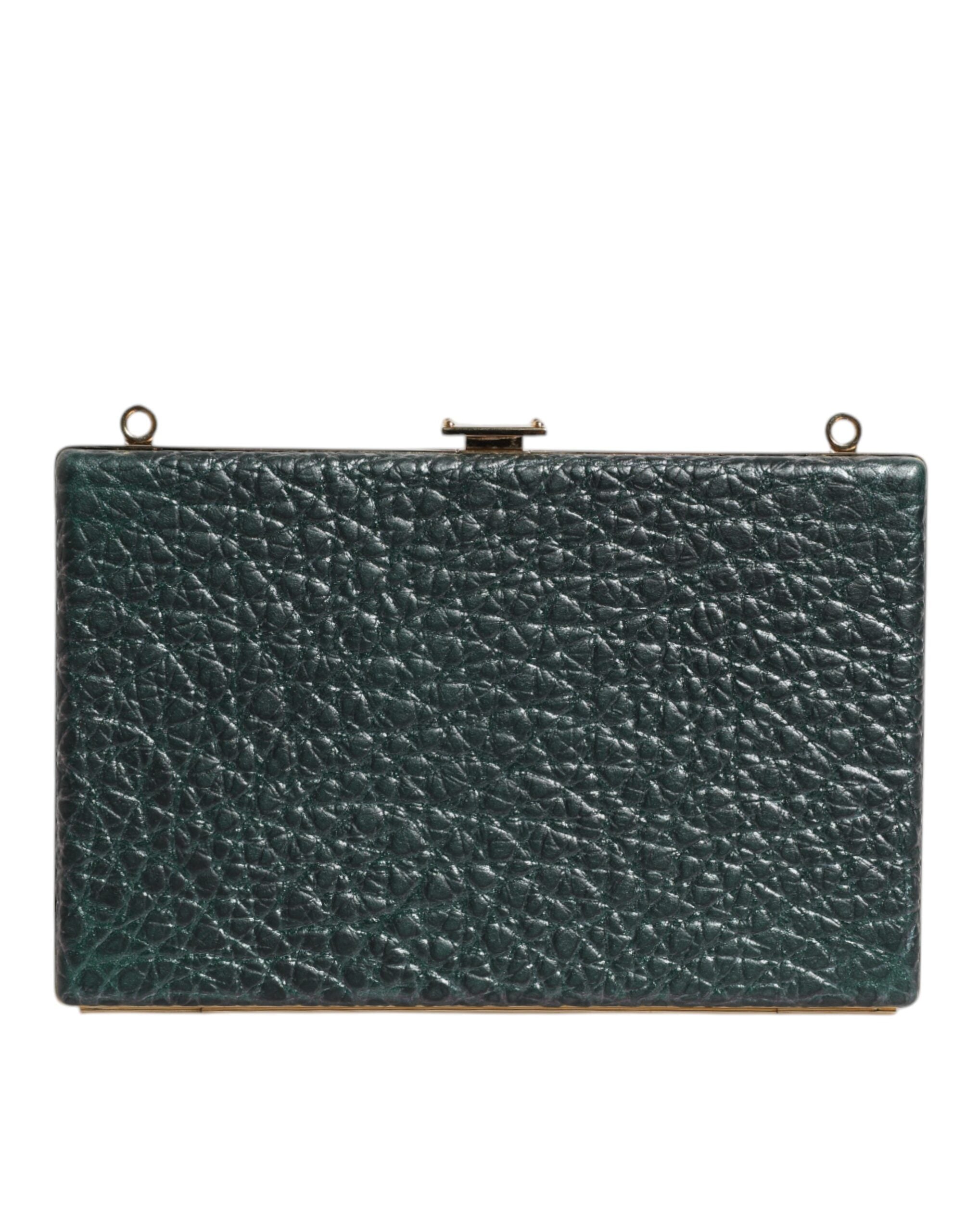 Sac clutch en cuir noir Dolce & Gabbana pour soirée, avec bandoulière et design élégant visible dans l'image.