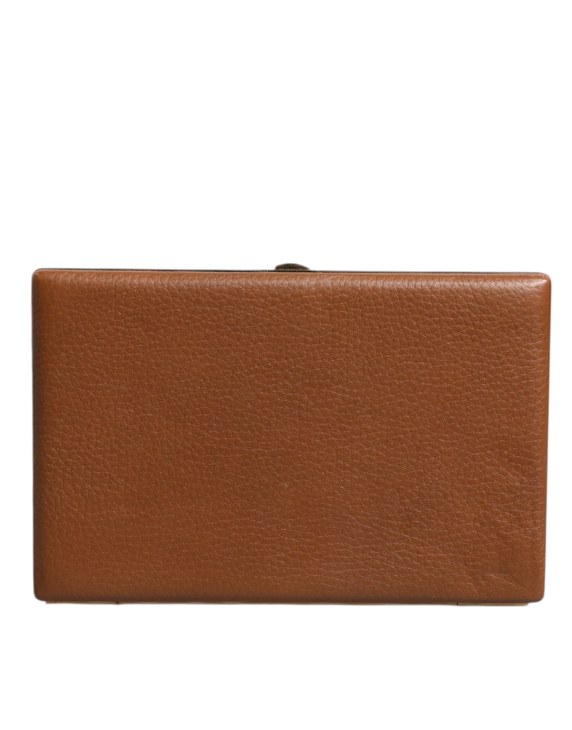 Sac clutch en cuir marron Dolce & Gabbana, élégant et parfait pour les soirées, avec une bandoulière croisée.
