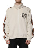 Veste en velours côtelé beige Dolce & Gabbana avec logo appliqué, fermeture éclair complète, style décontracté et élégant.