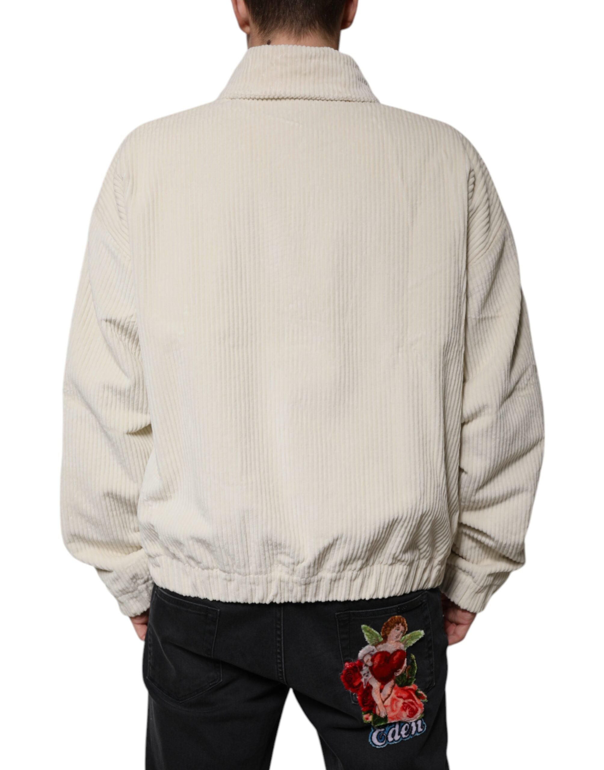 Veste en velours côtelé beige Dolce & Gabbana avec logo appliqué, fermeture éclair complète, style décontracté.