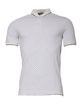 T-shirt polo blanc à pois en coton Dolce & Gabbana avec col, détails élégants et motif à pois noirs sur fond blanc.