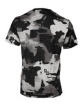 T-shirt Dolce & Gabbana à col rond multicolore avec motif camouflage, en coton, porté sur un mannequin.