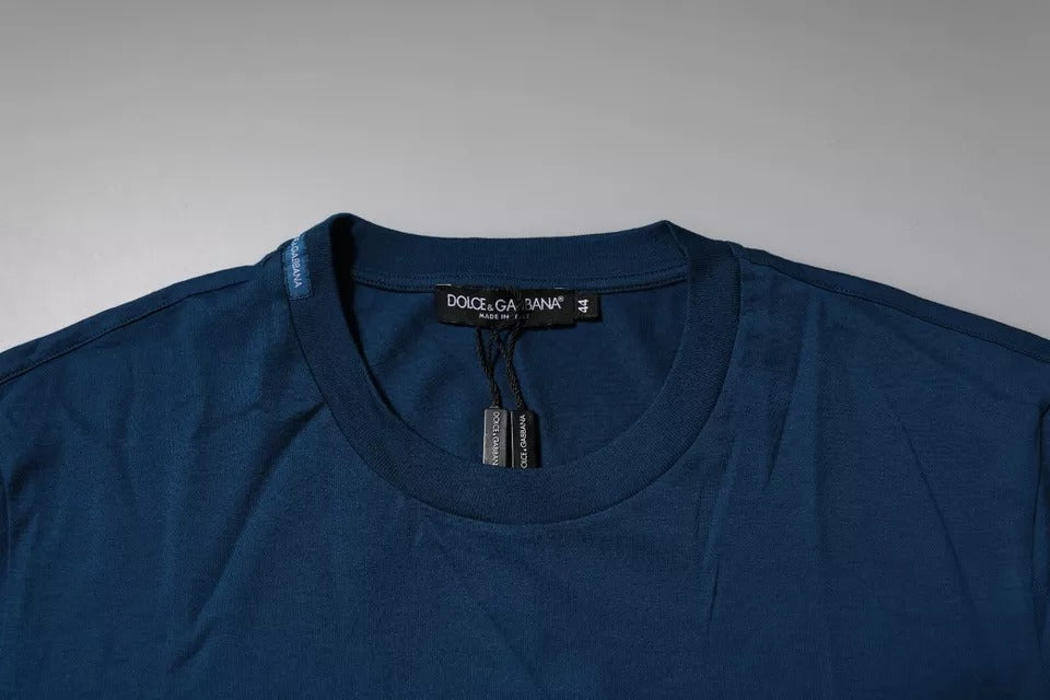 T-shirt homme Dolce & Gabbana en coton bleu avec motif couronne et abeille, col rond, design élégant et moderne.