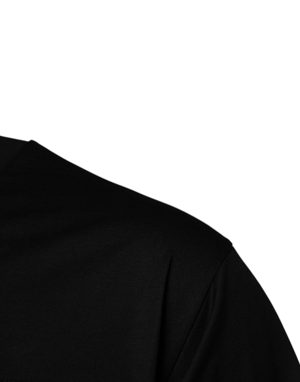 T-shirt à col rond en coton noir Dolce & Gabbana avec logo patch, style décontracté et moderne.