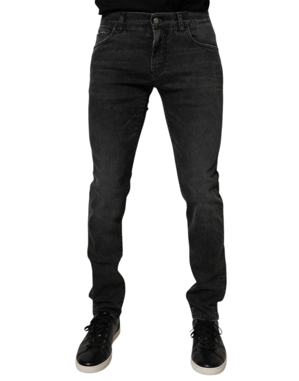 Jeans skinny en coton stretch noir pour homme de Dolce & Gabbana, détail de la coupe ajustée et de la texture denim.
