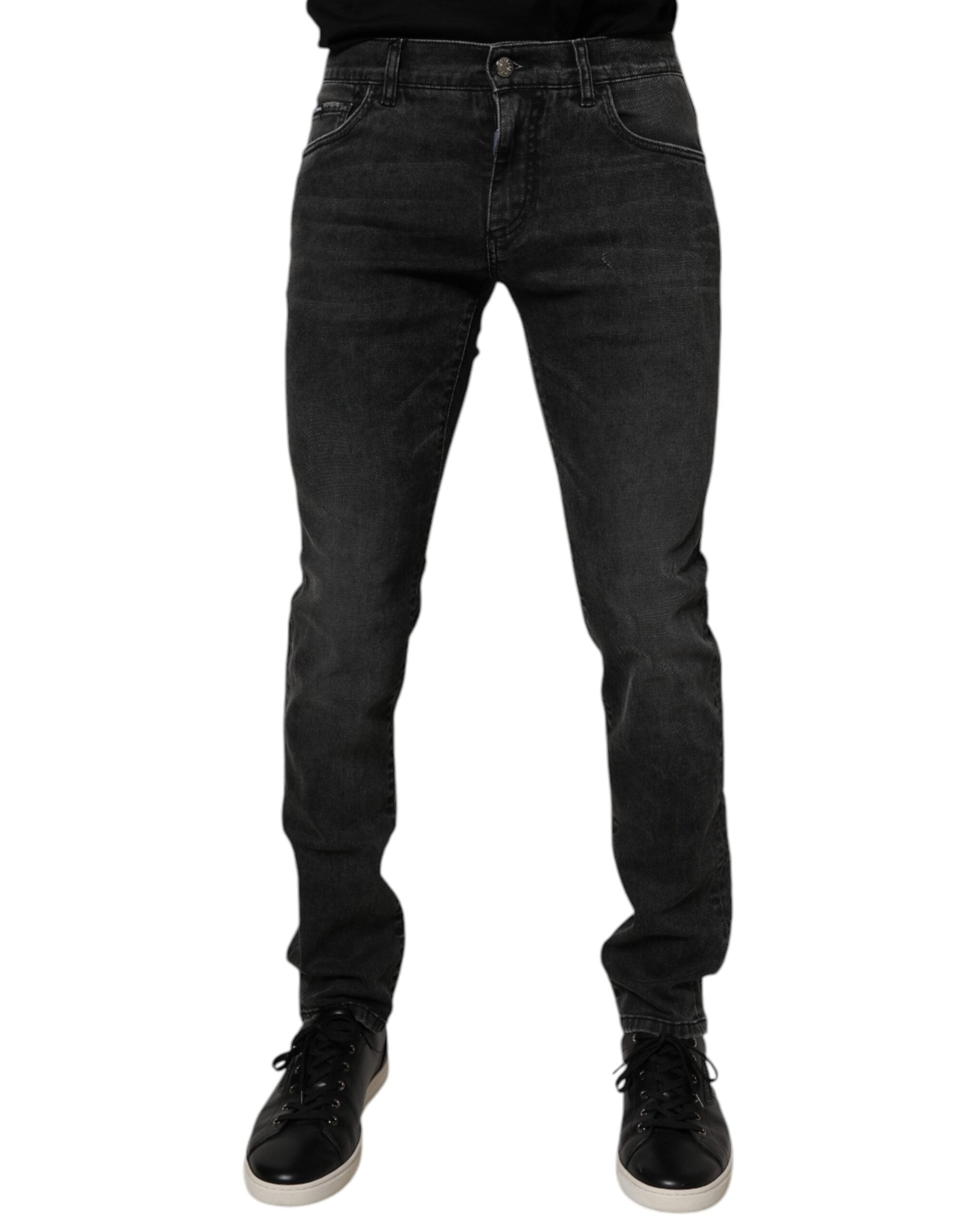 Jeans skinny en coton stretch noir pour homme de Dolce & Gabbana, détail de la coupe ajustée et de la texture denim.