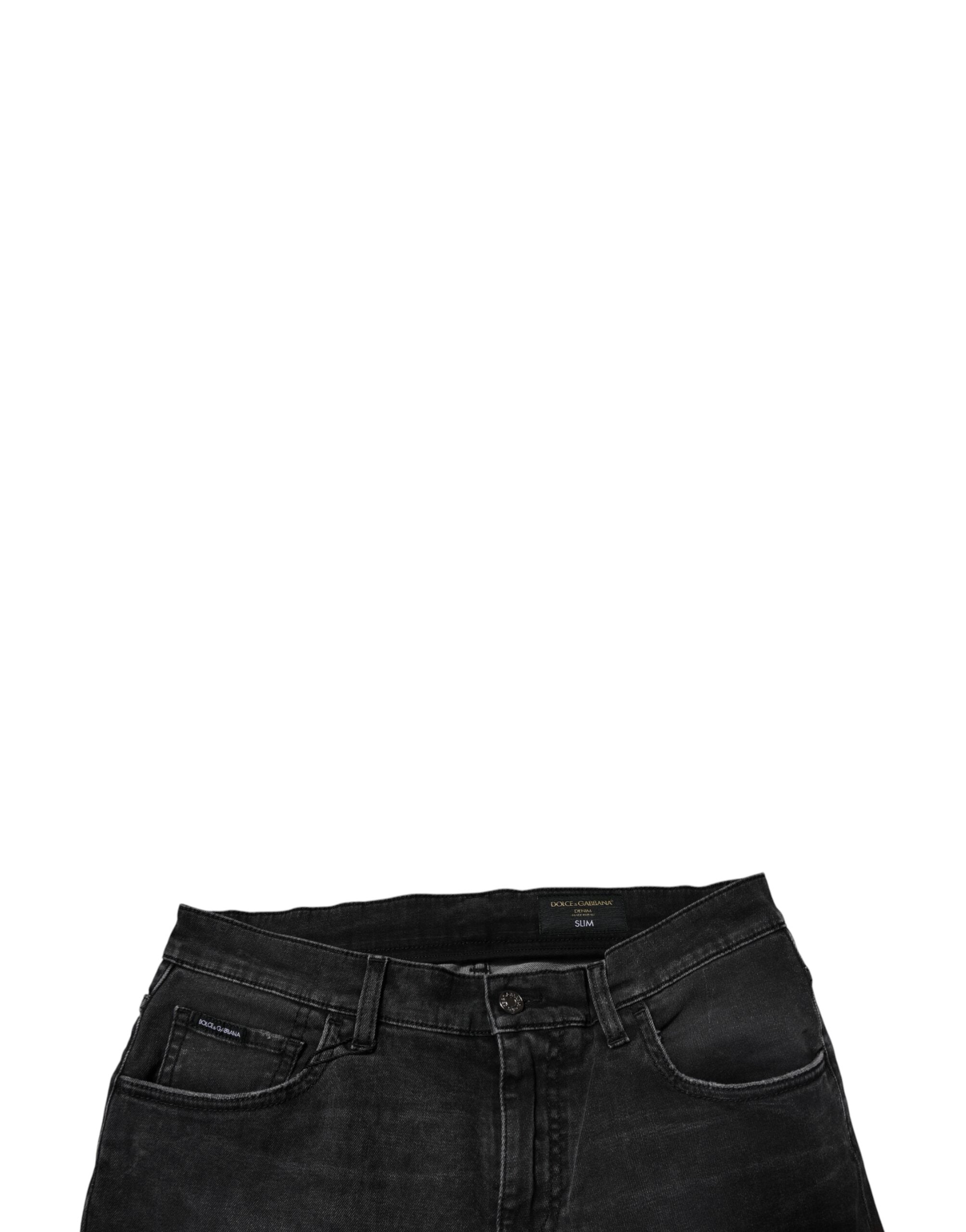 Jeans homme Dolce & Gabbana en coton noir, coupe skinny, denim stretch, visible détails de la texture et de la couture.