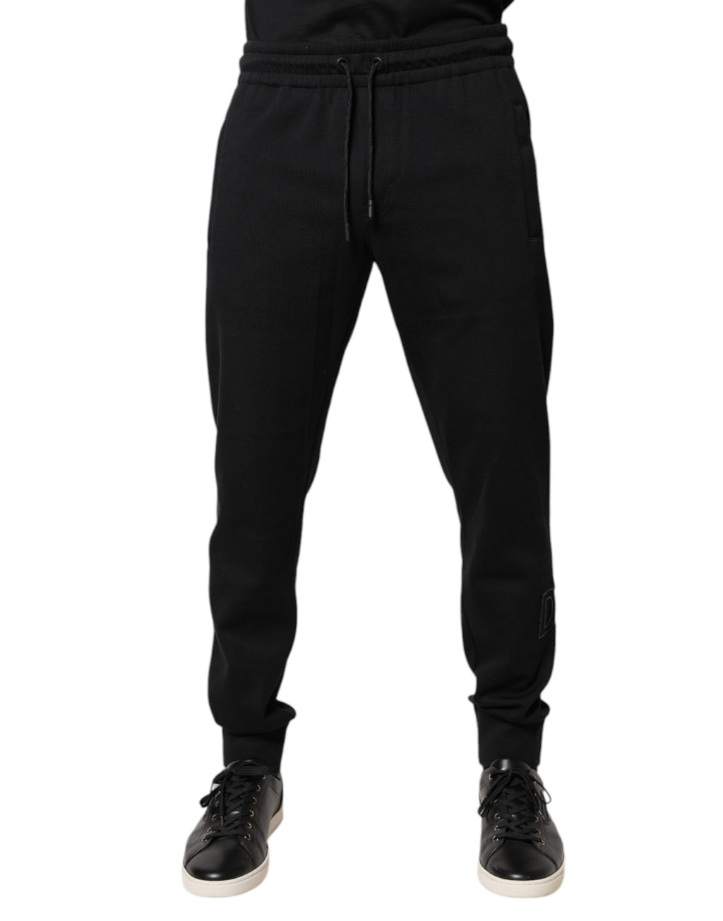 Pantalons de jogging noirs en coton de Dolce & Gabbana, style décontracté avec logo de la marque, visibles sur l'image.