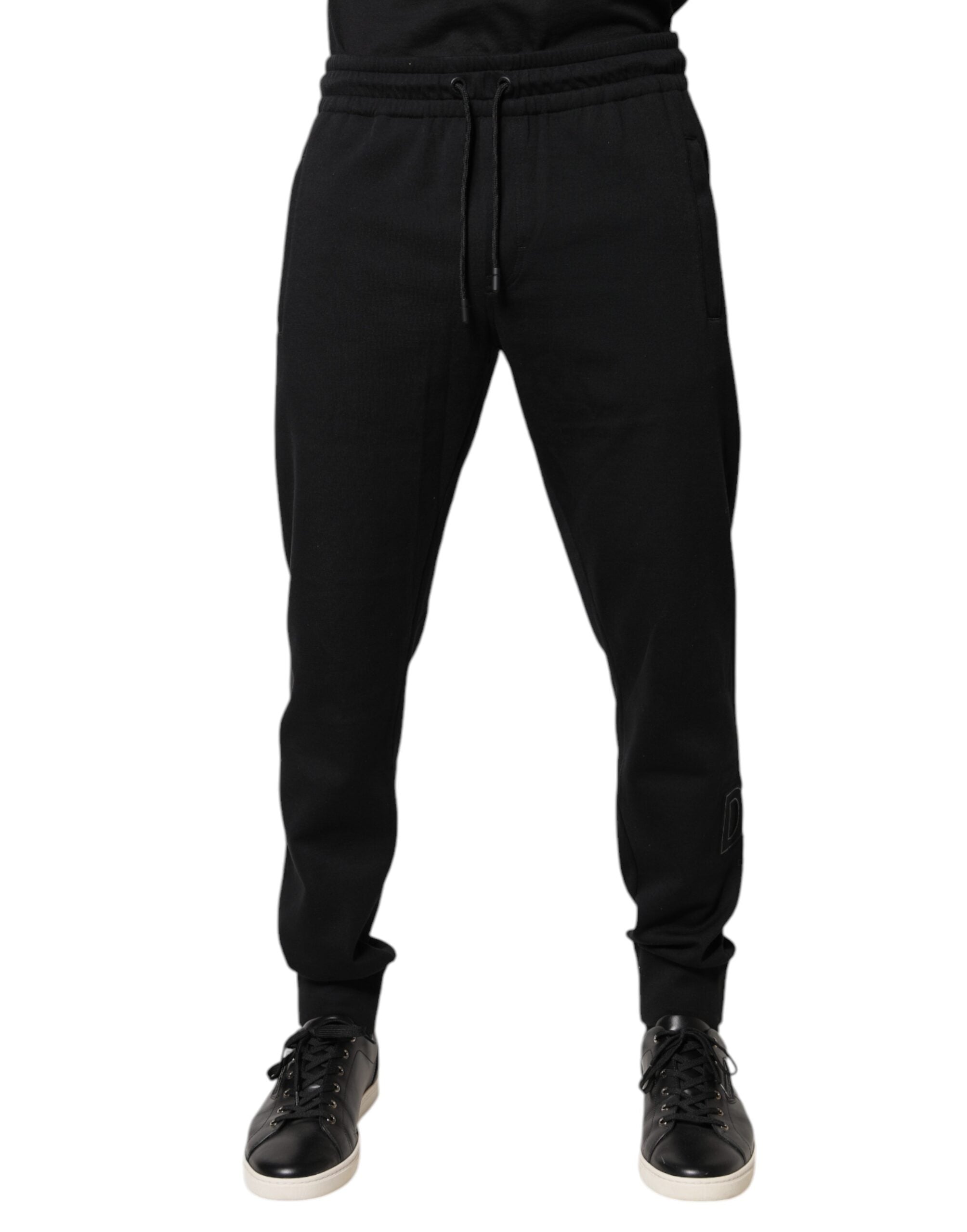 Pantalons de jogging en coton noir Dolce & Gabbana, coupe décontractée avec ceinture élastique et détails modernes.