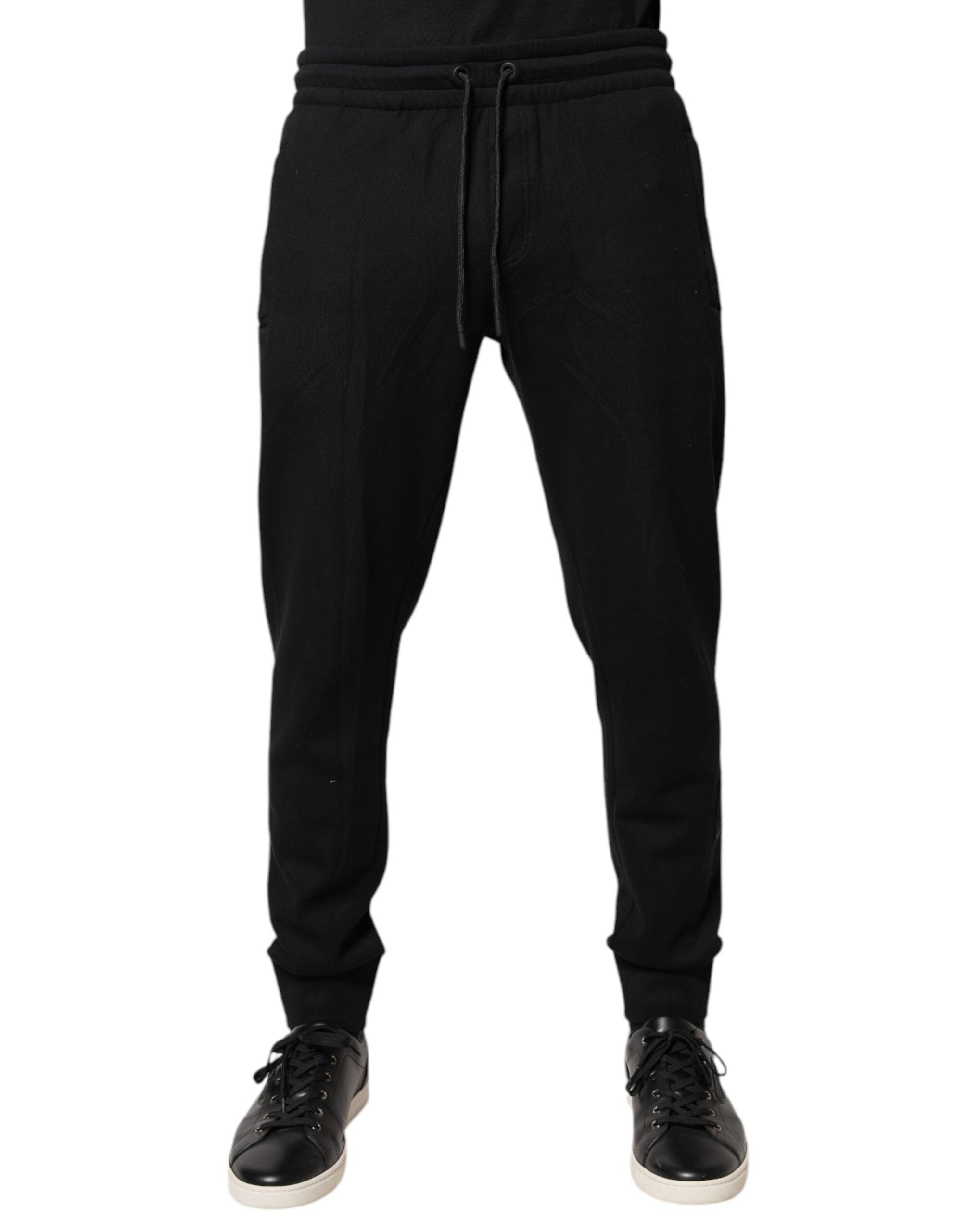 Pantalons de jogging noirs en coton de Dolce & Gabbana, style décontracté avec ceinture élastique et détails modernes.