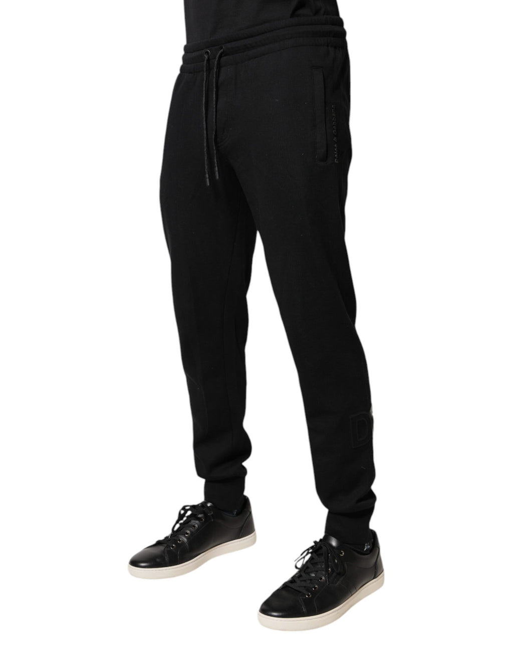 Pantalons joggers en coton noir Dolce & Gabbana, style décontracté avec ceinture élastique et poches modernes.