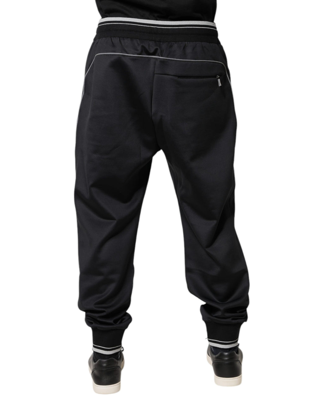 Pantalon jogging noir en polyester Dolce & Gabbana avec logo, décontracté et confortable, vue de face.