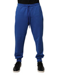 Pantalons joggers en coton bleu de taille moyenne Dolce & Gabbana, vue de face avec ceinture et détails de couture visibles.