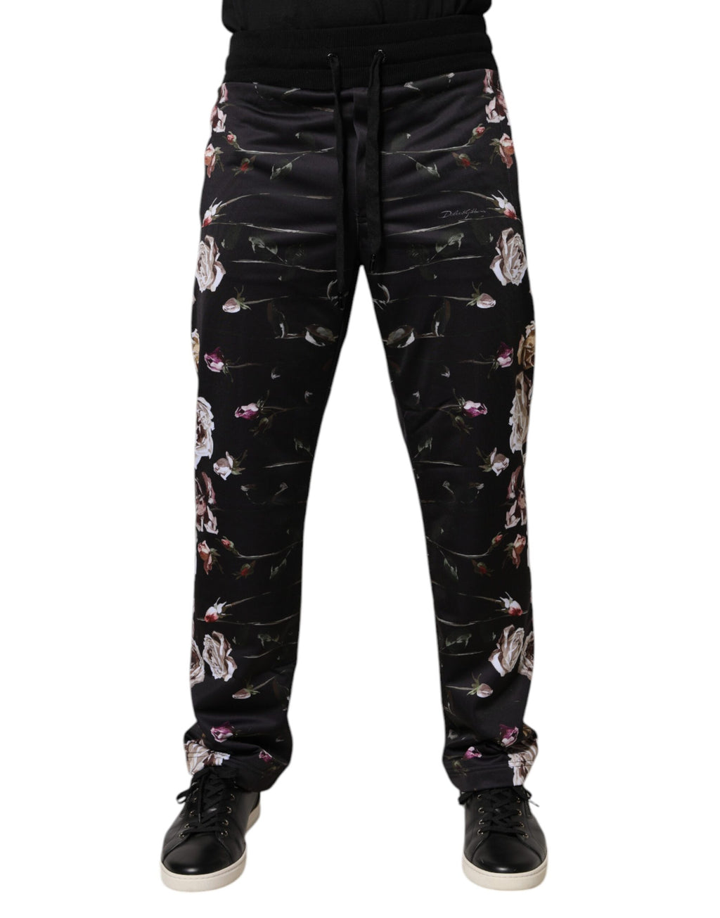 Pantalon jogging noir à fleurs en polyester de Dolce & Gabbana, coupe décontractée et détails floraux élégants.