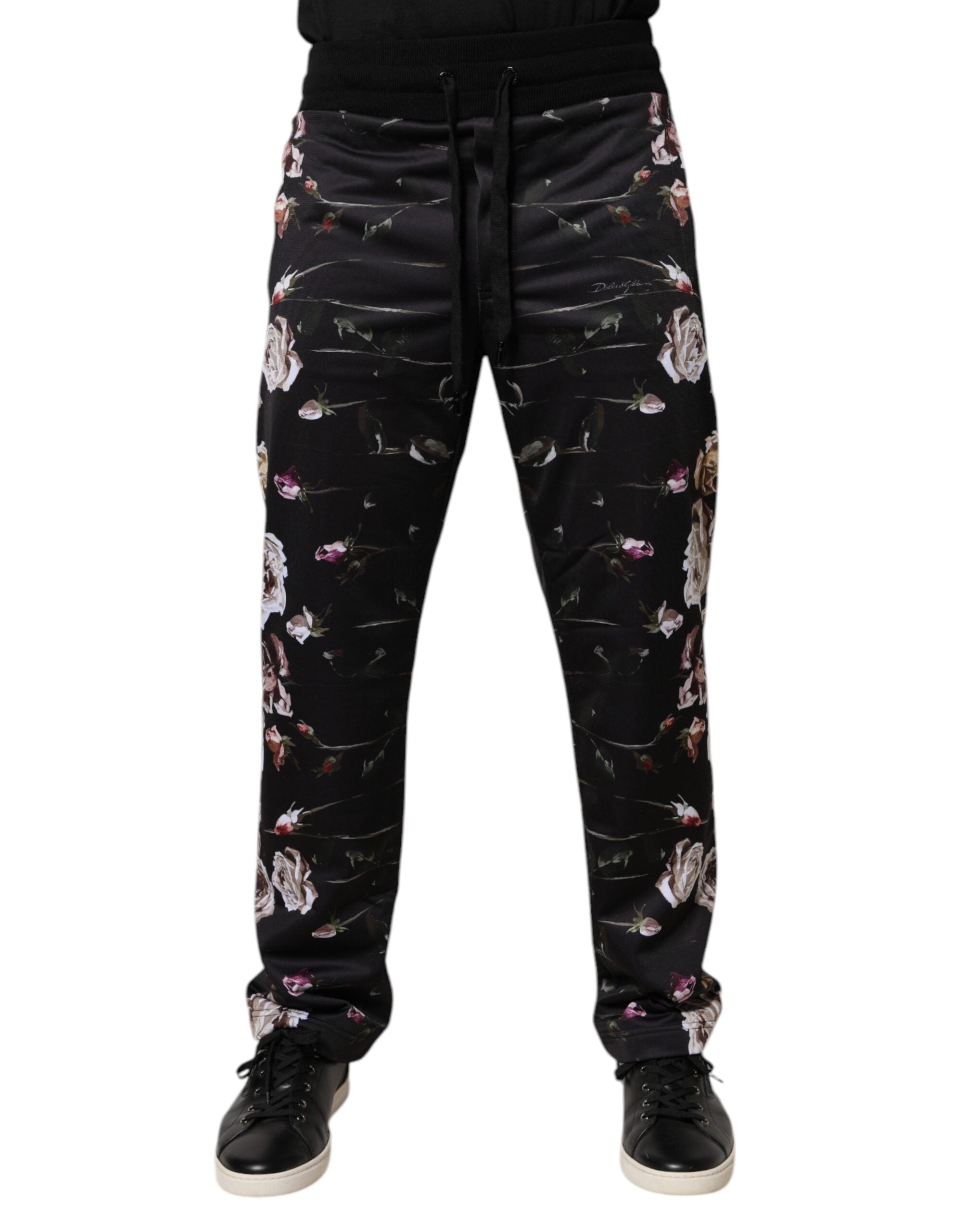 Pantalon jogging noir à fleurs en polyester de Dolce & Gabbana, coupe décontractée et détails floraux élégants.