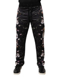 Pantalons de jogging en polyester noir à fleurs Dolce & Gabbana, style décontracté avec motif floral élégant.