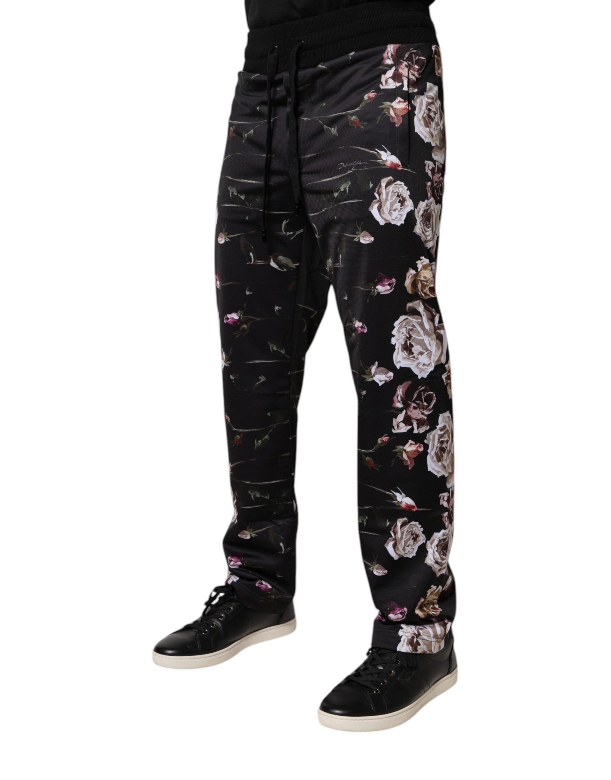 Pantalons jogger en polyester noir à fleurs Dolce & Gabbana, style décontracté et tendance, visibles avec détails floraux.