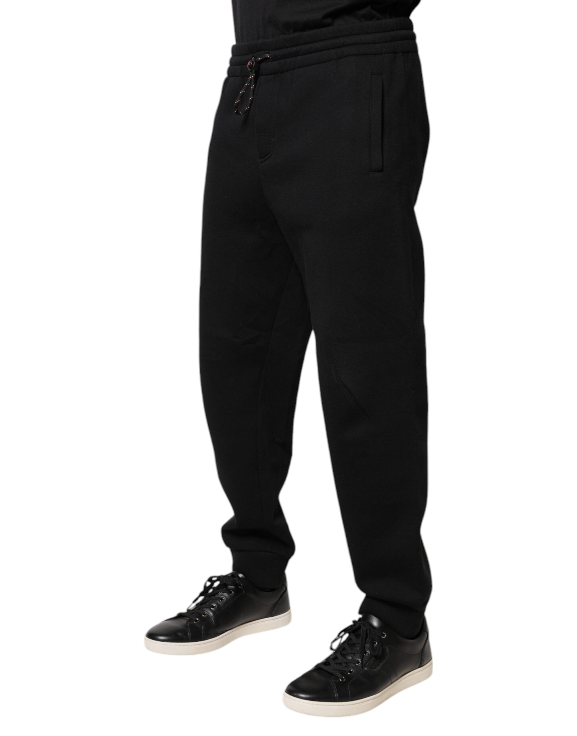Pantalons de jogging en coton noir Dolce & Gabbana avec patch logo, style décontracté et confortable.