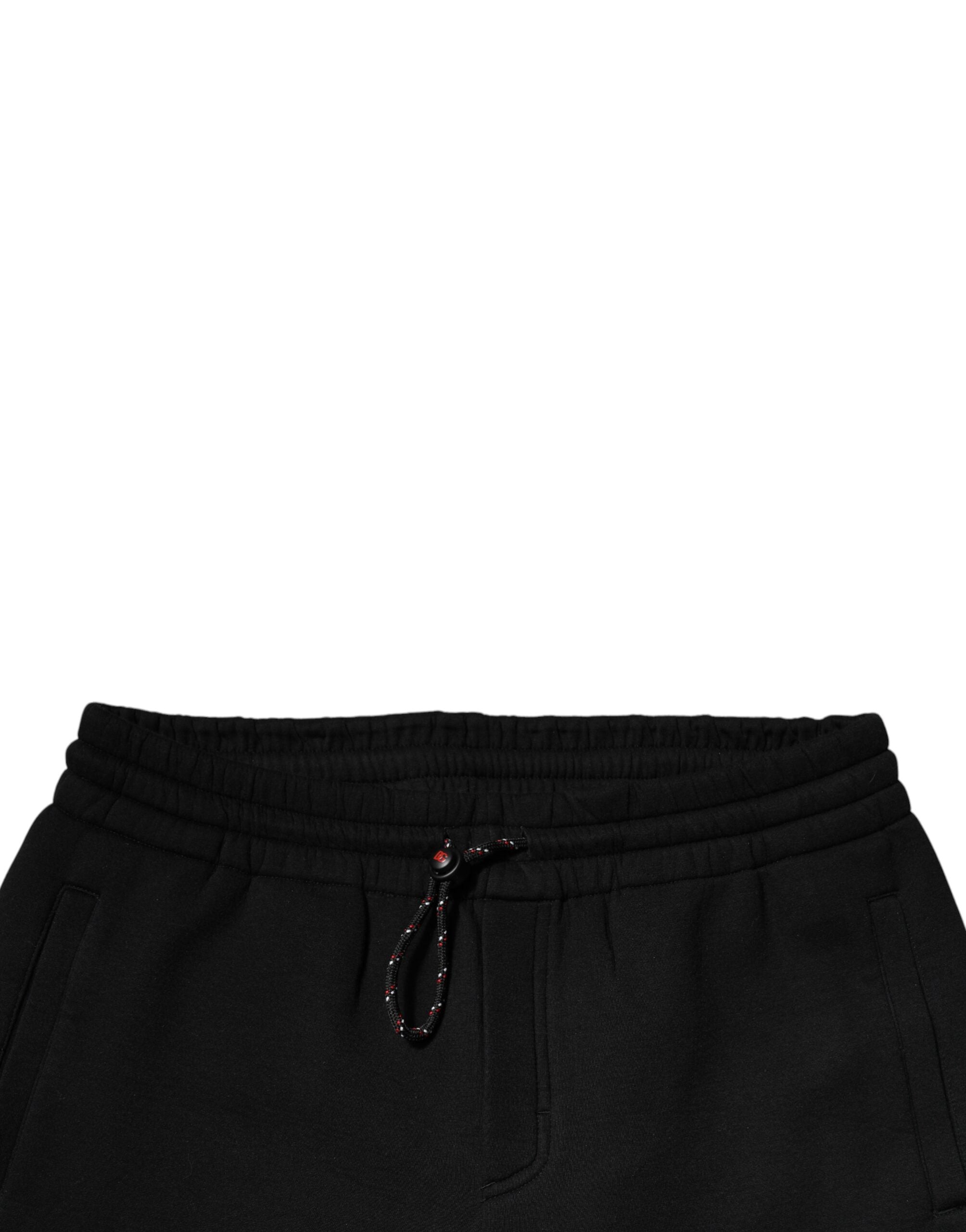 Pantalons joggers en coton noir Dolce & Gabbana avec patch logo, style décontracté et moderne.