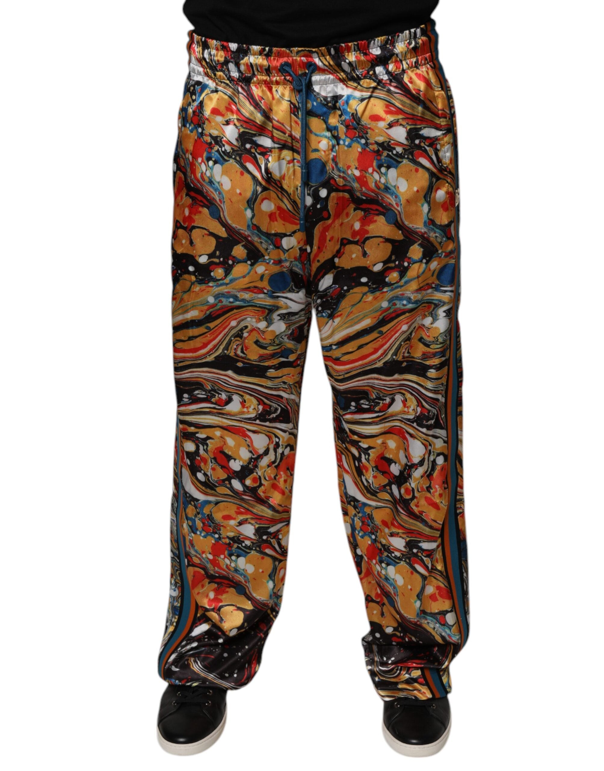 Pantalon de jogging homme Dolce & Gabbana en satin avec motif marbré multicolore.