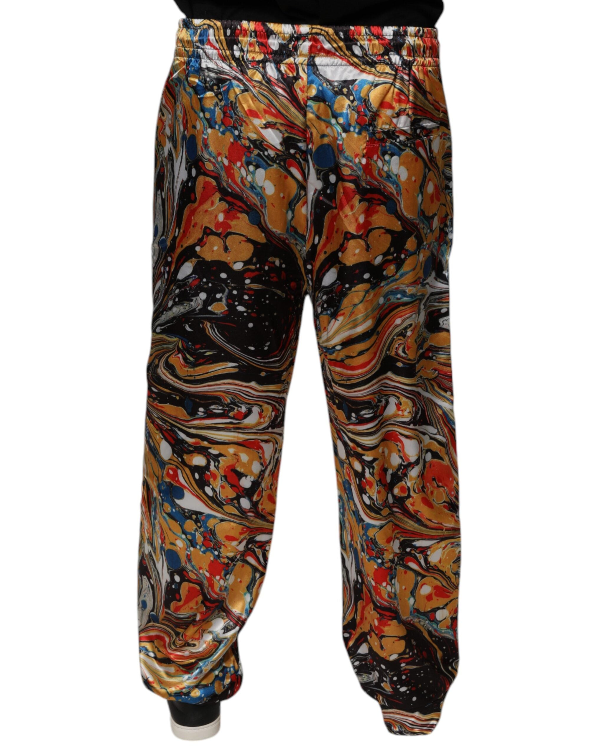 Pantalon de survêtement homme Dolce & Gabbana en satin multicolore marbré avec détails élégants.