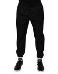 Pantalon de jogging noir en coton pour homme de Dolce & Gabbana, coupe décontractée avec ceinture élastique et logo discret.