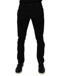 Jean skinny en coton déchiré noir de Dolce & Gabbana pour homme, denim tendance avec détails usés.