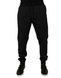 Pantalon jogger pour homme Dolce & Gabbana en polyester noir, coupe décontractée avec ceinture élastique et poches.