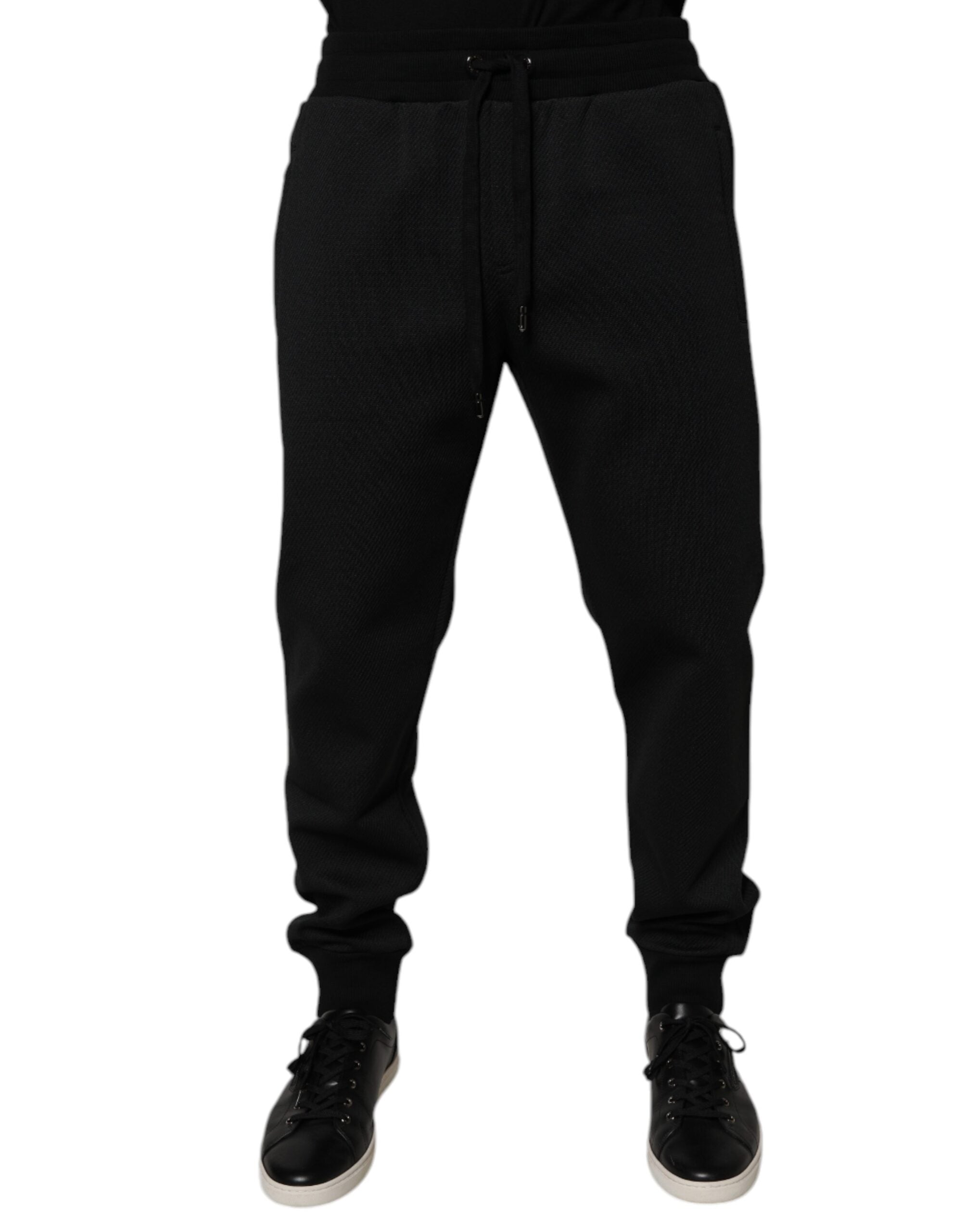 Pantalon jogger pour homme Dolce & Gabbana en polyester noir, coupe décontractée avec ceinture élastique et poches.